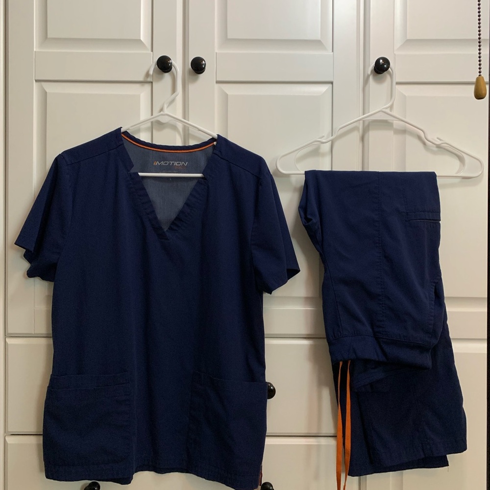 Women’s navy scrubs. Motion by Barco. LARGE TOP. SMALL PANTS (fits like medium)